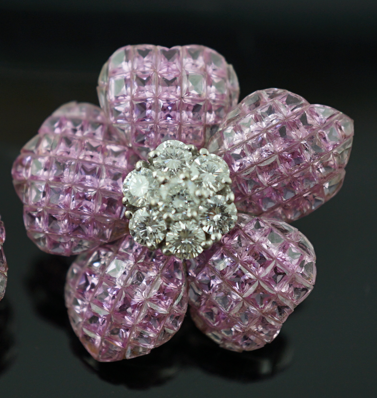 A pair of 18k white gold, pink sapphire and diamond cluster set flower head ear clips/earrings